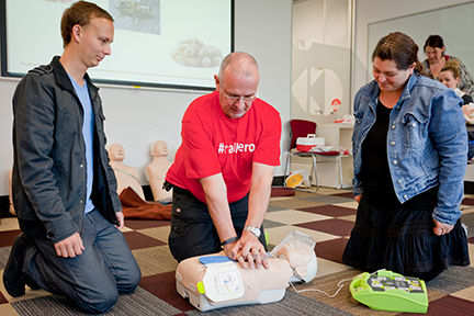 Trainer demonstrating on a manikin to students