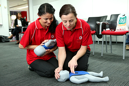 Demonstration of CPR on a baby manikin