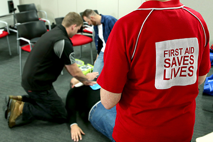 Students practicing CPR on a manikin